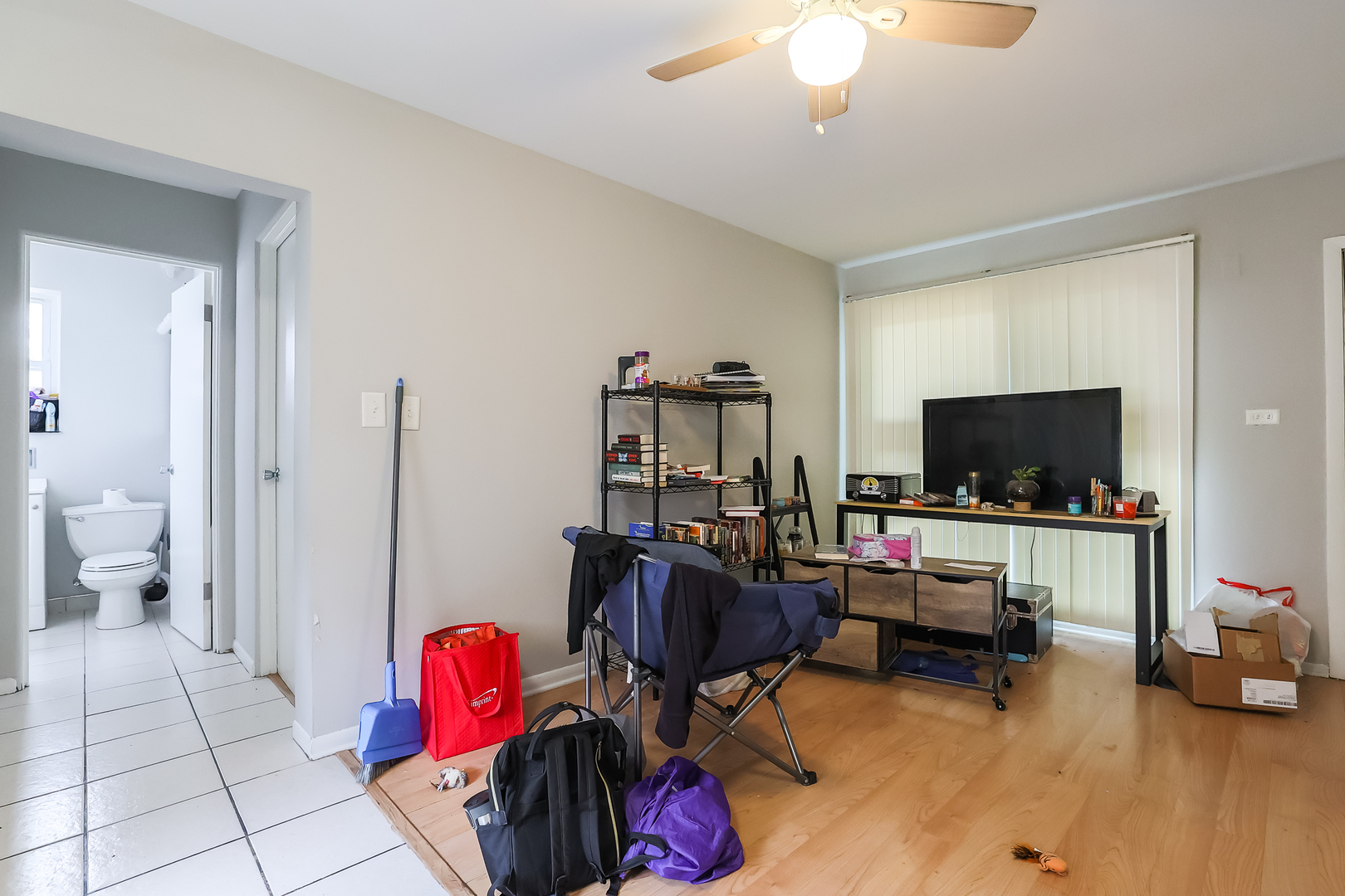 7242 Roosevelt Road Forest Park, IL 60130 - Photo 33 of 36 a living room with furniture and a flat screen tv