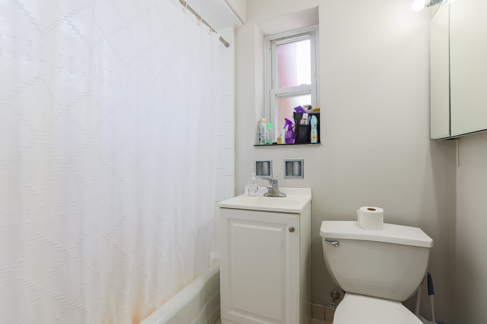 7242 Roosevelt Road Forest Park, IL 60130 - Photo 34 of 36 a bathroom with a toilet sink and mirror