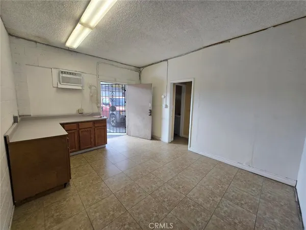 a view of a kitchen with a sink and cabinets