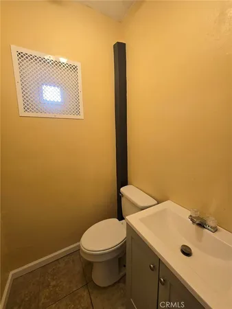 a bathroom with a sink and toilet