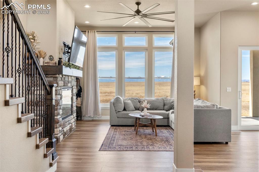 2480 North Log Road Calhan, CO 80808 - Photo 12 of 50 a living room with furniture and a fireplace