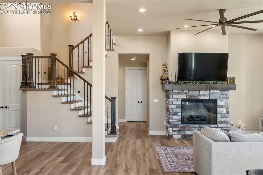 2480 North Log Road Calhan, CO 80808 - Photo 15 of 50 a living room with furniture a flat screen tv and a fireplace