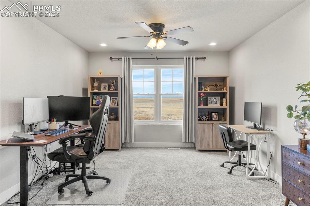 2480 North Log Road Calhan, CO 80808 - Photo 24 of 50 a view of a workspace with furniture and a window