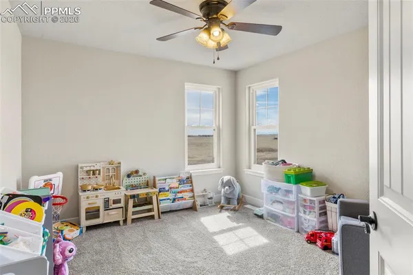 an empty room with a empty space and windows