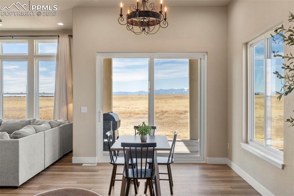 2480 North Log Road Calhan, CO 80808 - Photo 10 of 50 a view of a dining room with furniture window and outside view