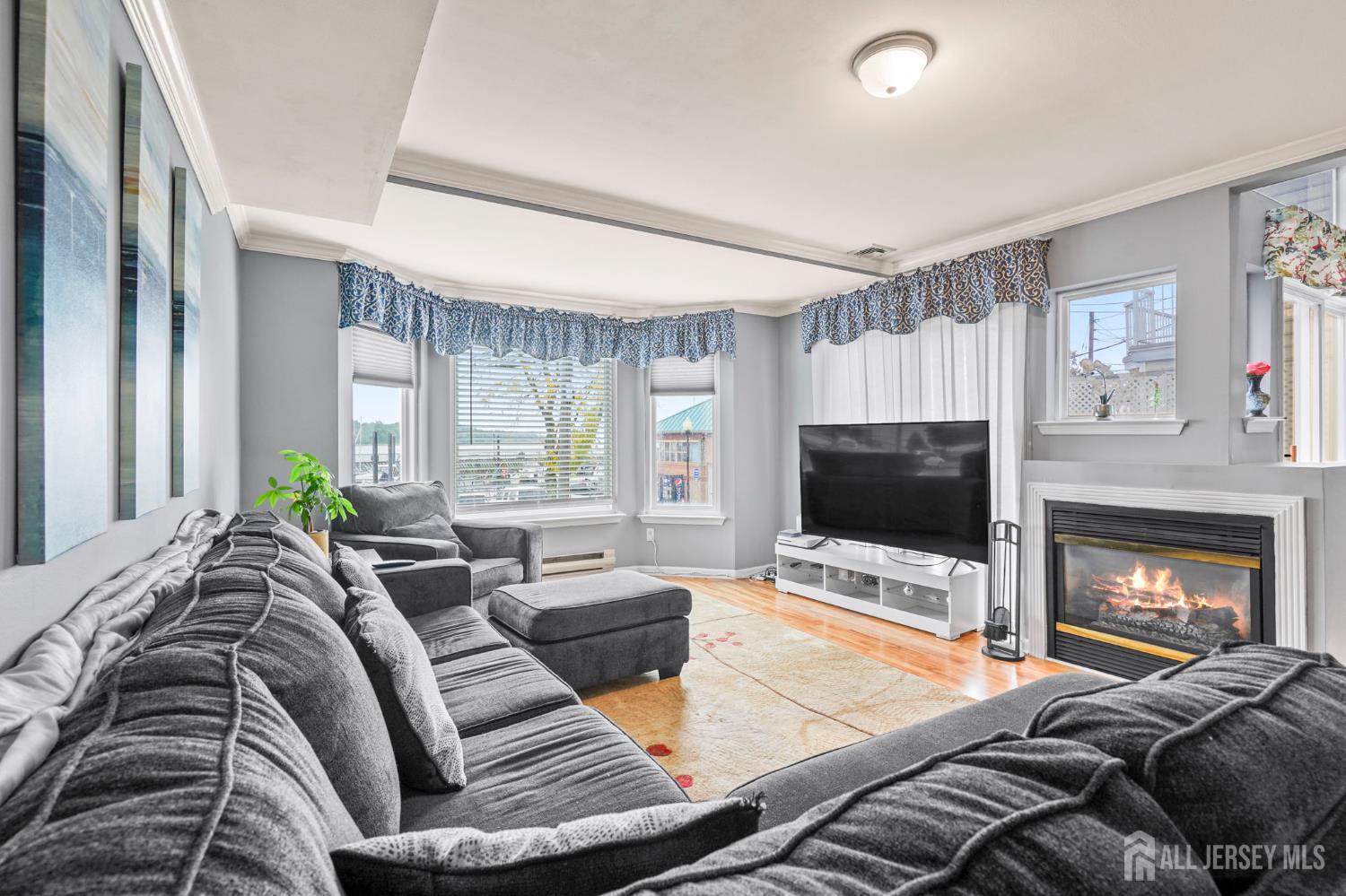 265 Front Street Perth Amboy, NJ 08861 - Photo 13 of 38 a living room with furniture fireplace and flat screen tv