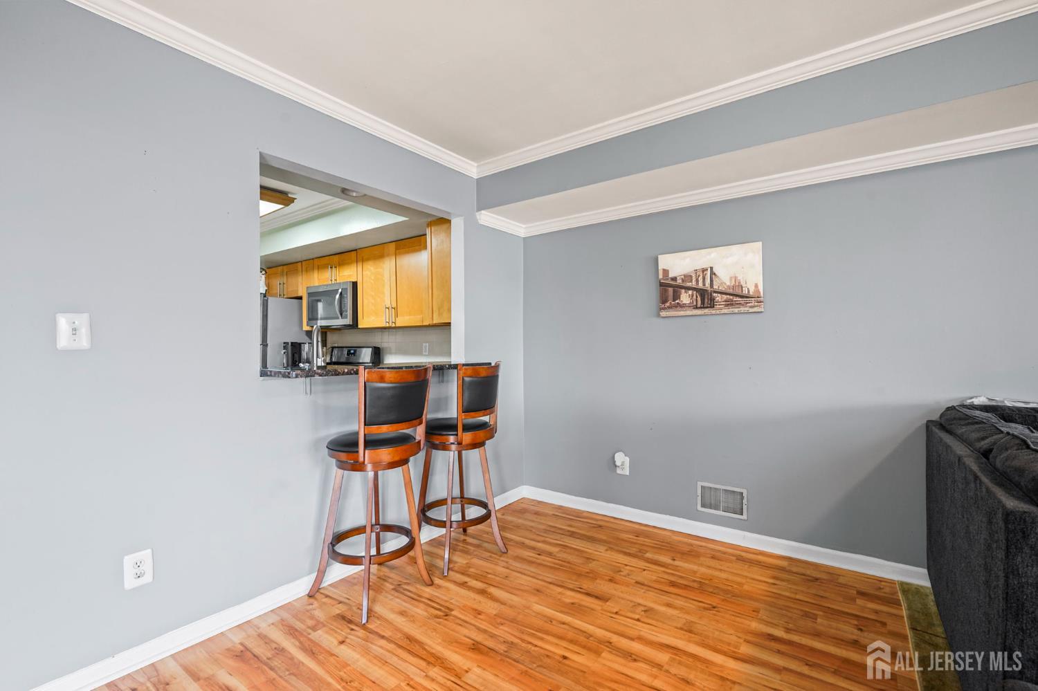 265 Front Street Perth Amboy, NJ 08861 - Photo 15 of 38 a view of a workspace with furniture and a window