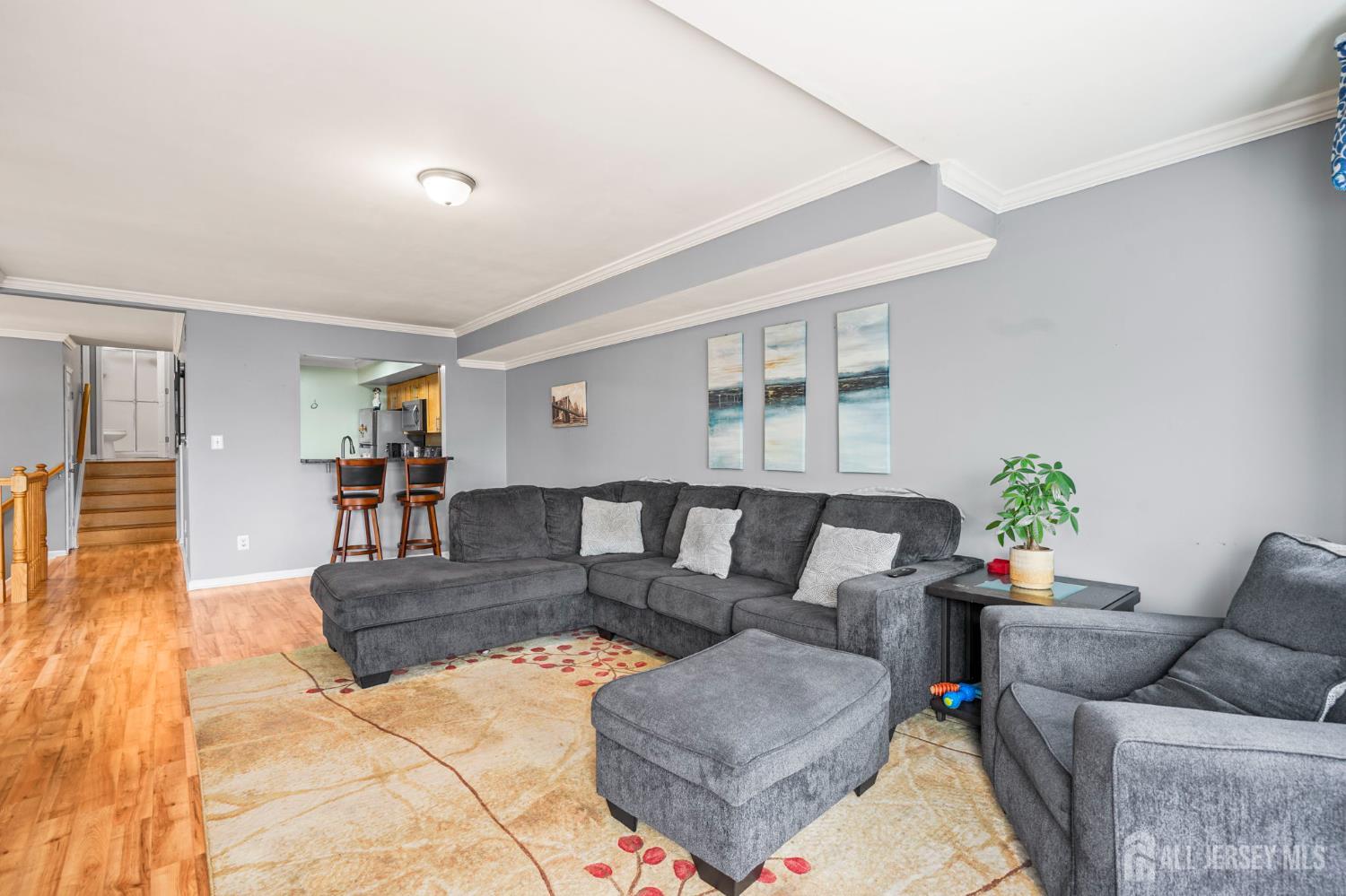 265 Front Street Perth Amboy, NJ 08861 - Photo 16 of 38 a living room with furniture and wooden floor