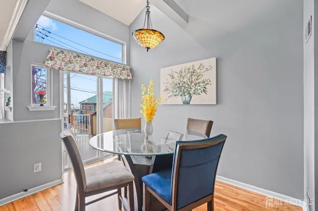 a dining room with furniture and window