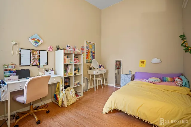 a bedroom with a bed and a bookshelf