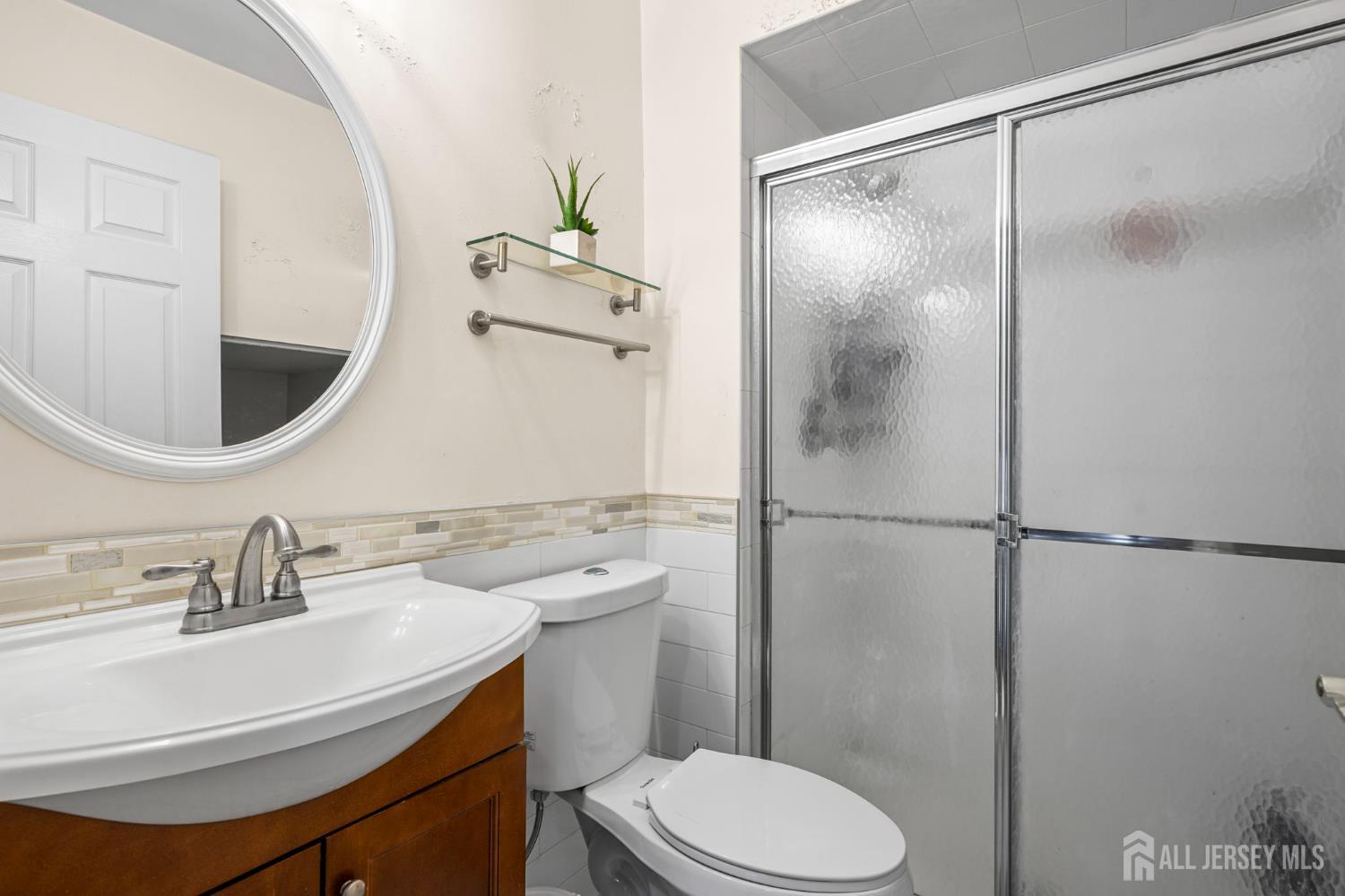265 Front Street Perth Amboy, NJ 08861 - Photo 23 of 38 a bathroom with a sink toilet and shower