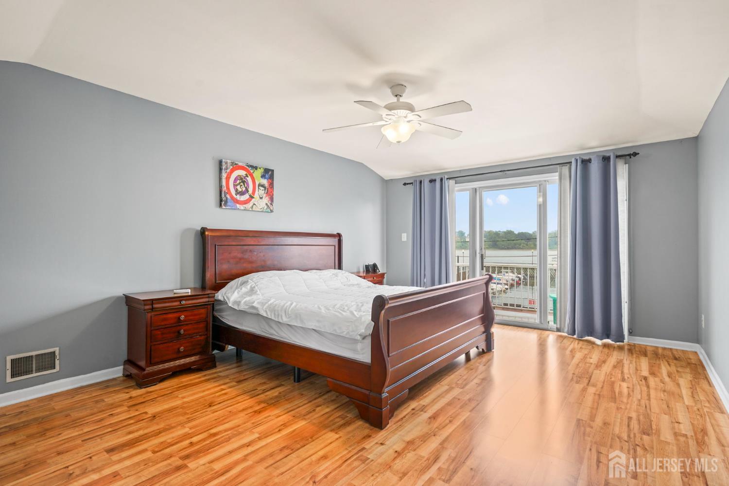 265 Front Street Perth Amboy, NJ 08861 - Photo 25 of 38 a bedroom with a bed and window