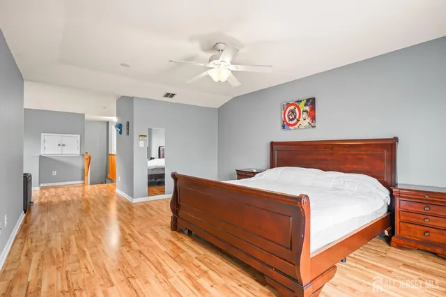 a bed room with a bed and a chandelier