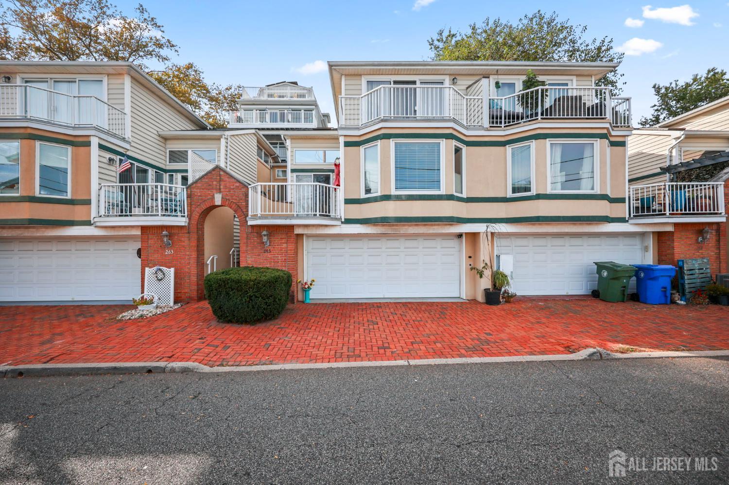 265 Front Street Perth Amboy, NJ 08861 - Photo 3 of 38 a view of a house with a yard and potted plants