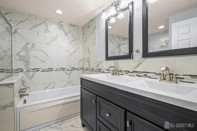 a bathroom with a bathtub and a sink