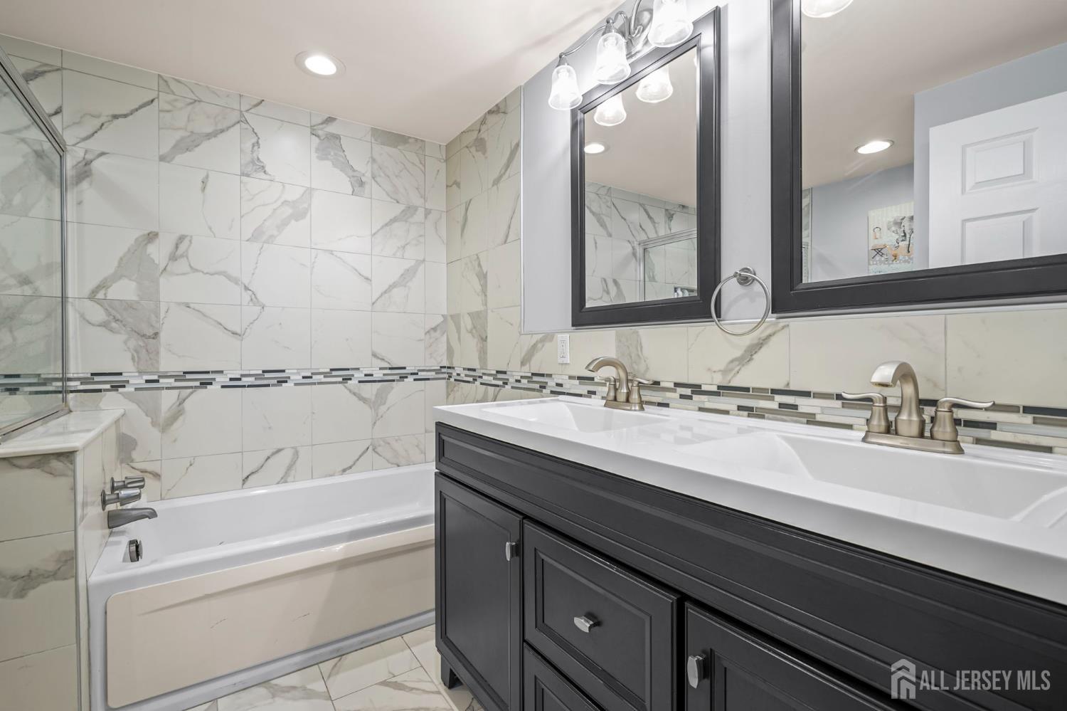 265 Front Street Perth Amboy, NJ 08861 - Photo 34 of 38 a bathroom with a bathtub and a sink