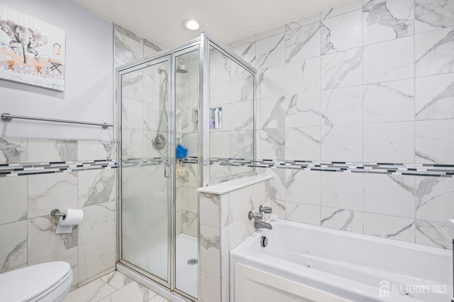 265 Front Street Perth Amboy, NJ 08861 - Photo 35 of 38 a bathroom with a bathtub and a shower