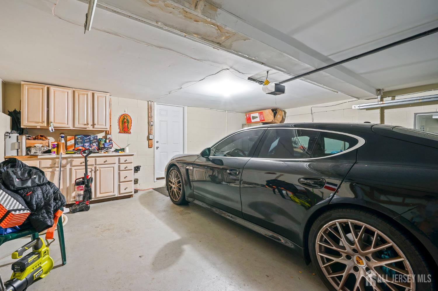 265 Front Street Perth Amboy, NJ 08861 - Photo 37 of 38 a utility room with stainless steel appliances lots of white furniture