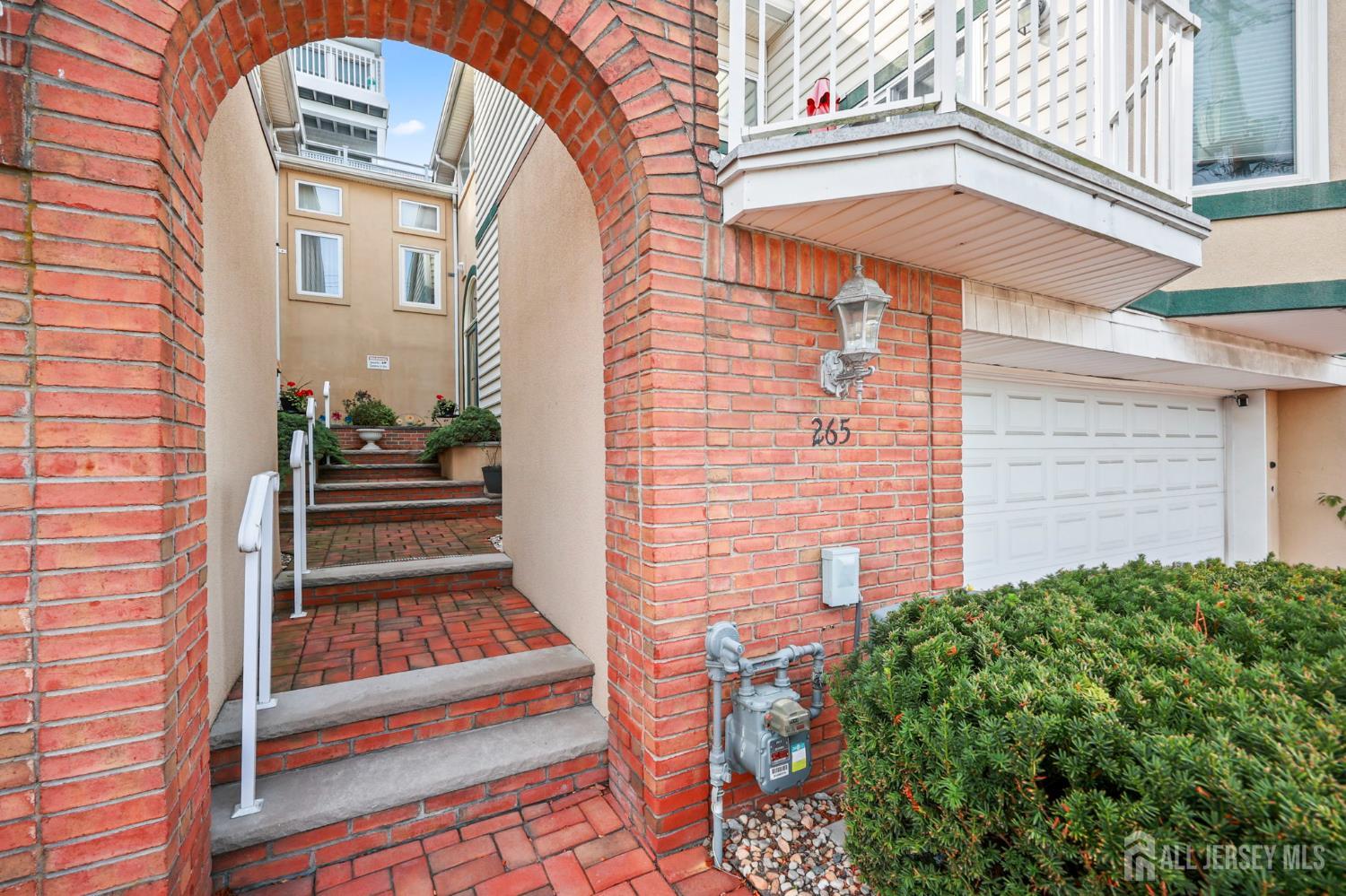 265 Front Street Perth Amboy, NJ 08861 - Photo 5 of 38 a front view of a house with stairs