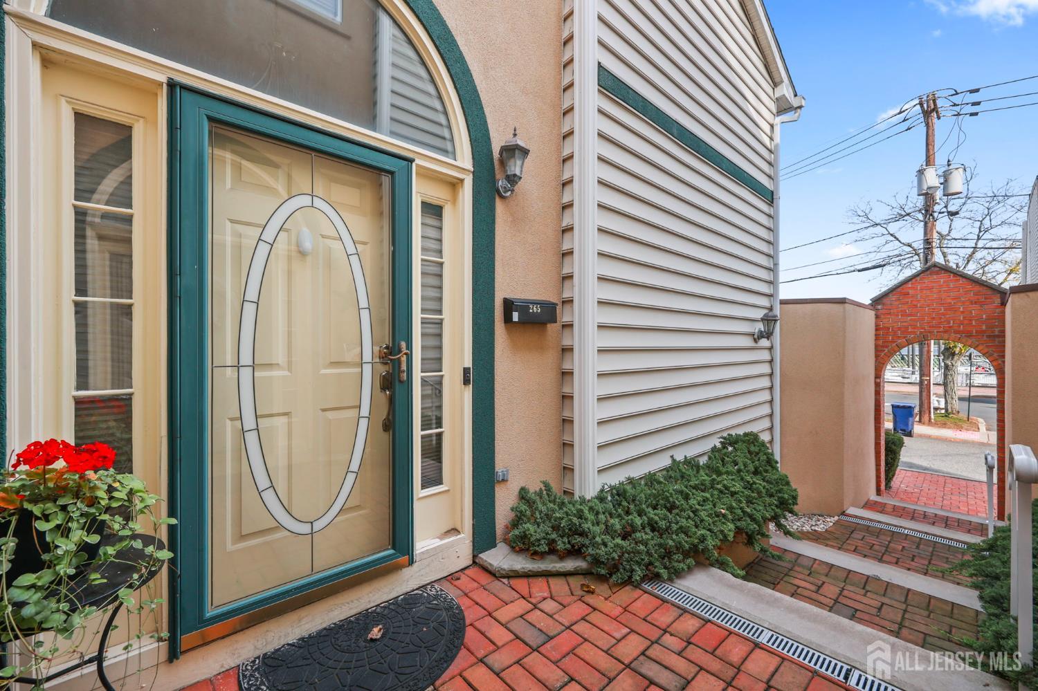 265 Front Street Perth Amboy, NJ 08861 - Photo 7 of 38 a front view of a house with a yard