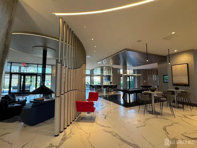 a living room with lots of furniture and appliances