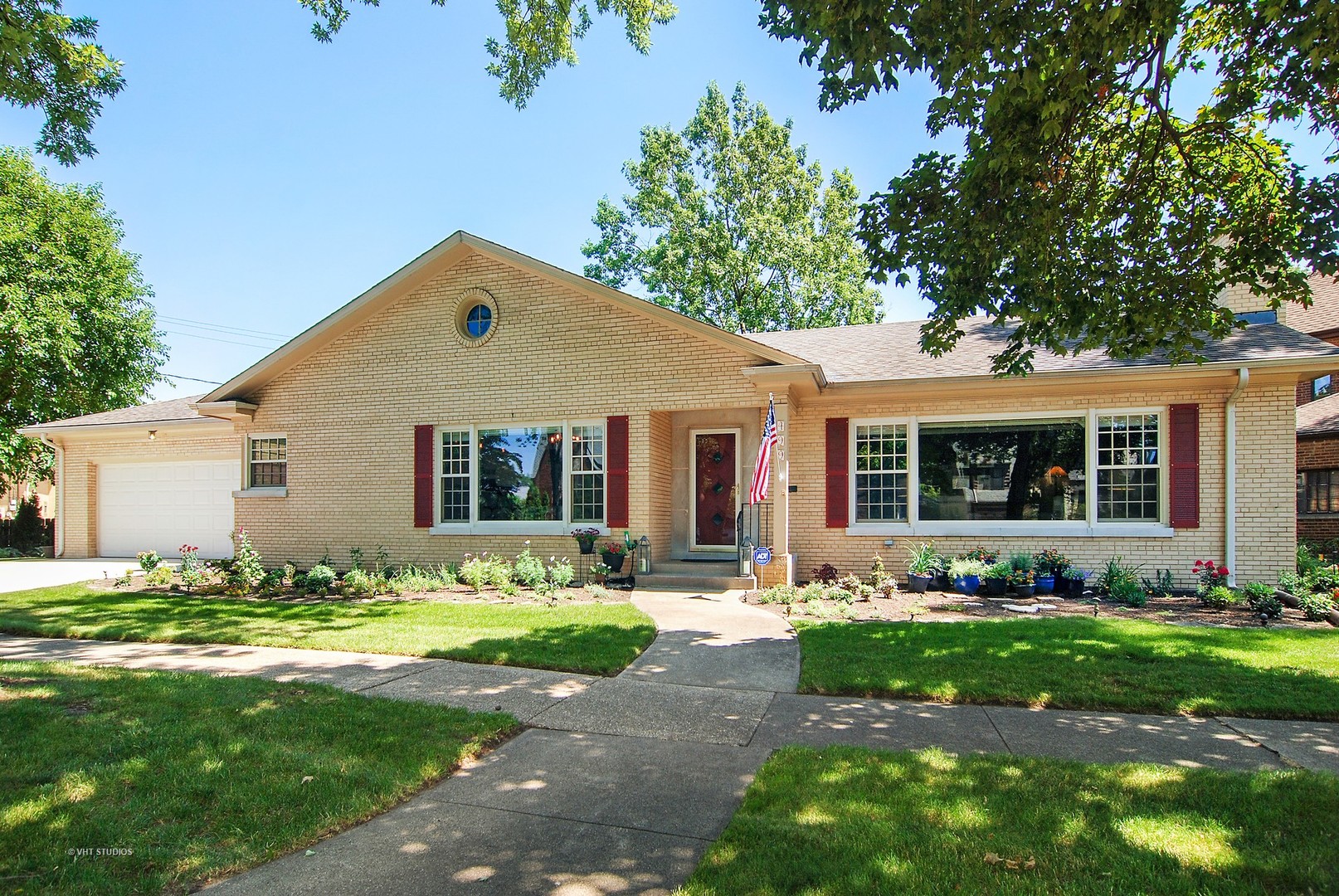499 Kent Road Riverside, IL 60546 - Photo 1 of 28 a front view of a house with garden