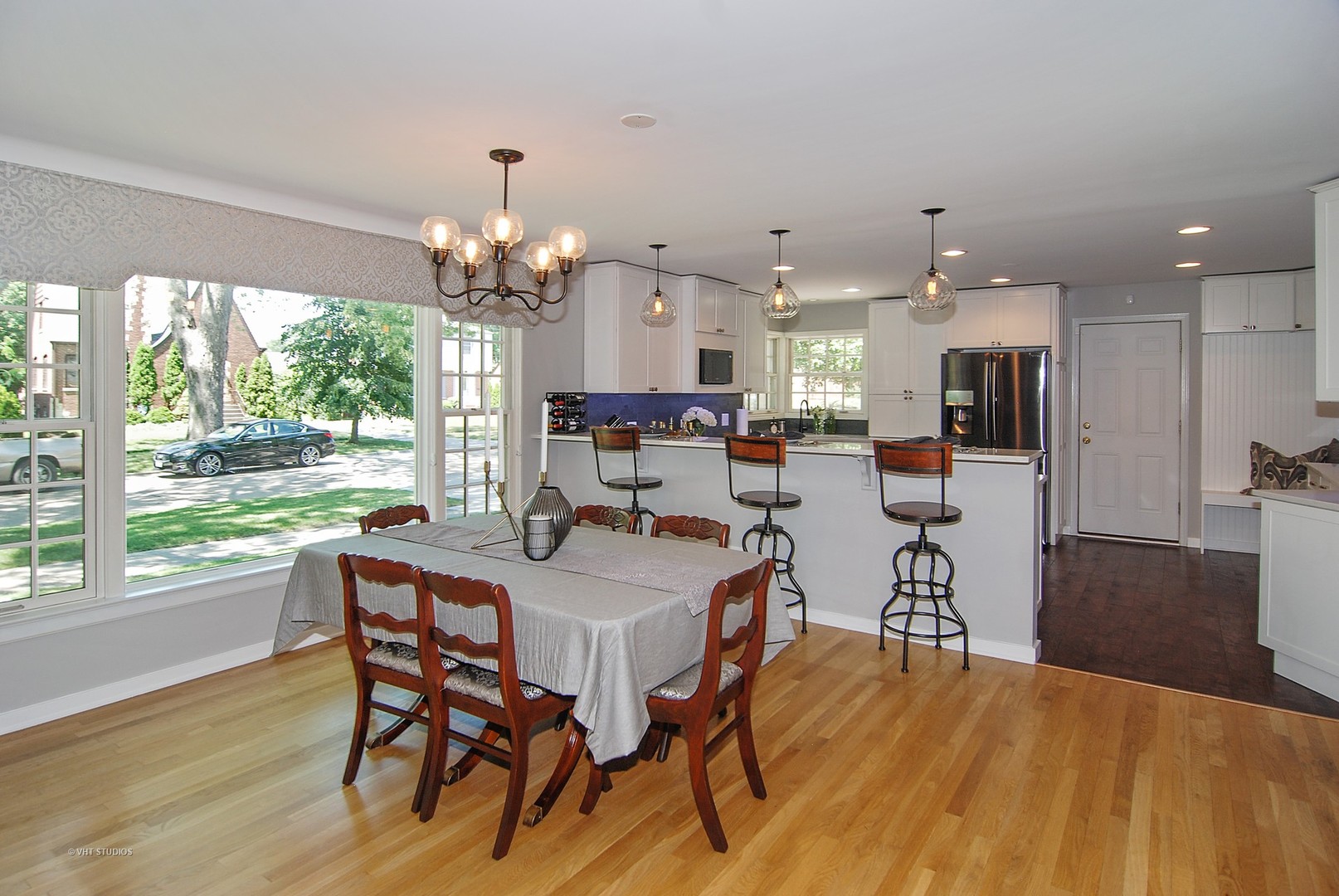 499 Kent Road Riverside, IL 60546 - Photo 12 of 28 a view of a dining room with furniture window and wooden floor