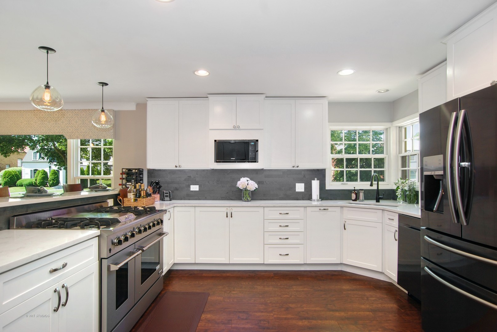 499 Kent Road Riverside, IL 60546 - Photo 6 of 28 a kitchen with stainless steel appliances a stove sink and refrigerator