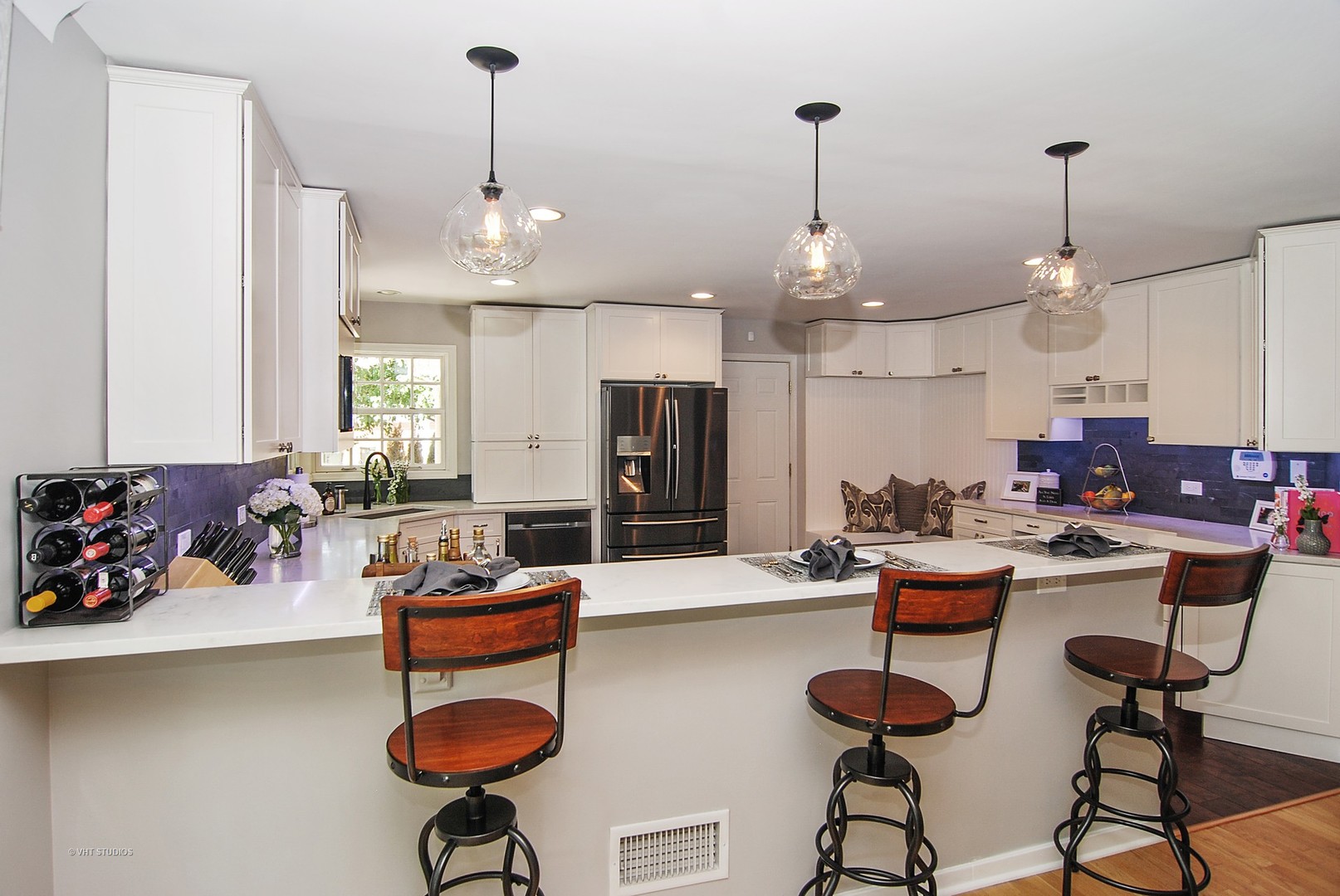 499 Kent Road Riverside, IL 60546 - Photo 7 of 28 a room with stainless steel appliances kitchen island granite countertop dining table chairs and a view of living room