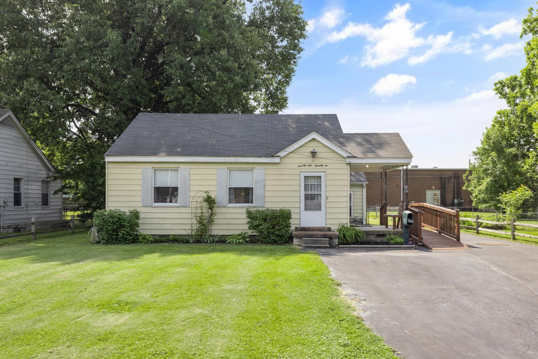 7976 Susan Road Millington, TN 38053 - Photo 1 of 25 a front view of a house with a yard