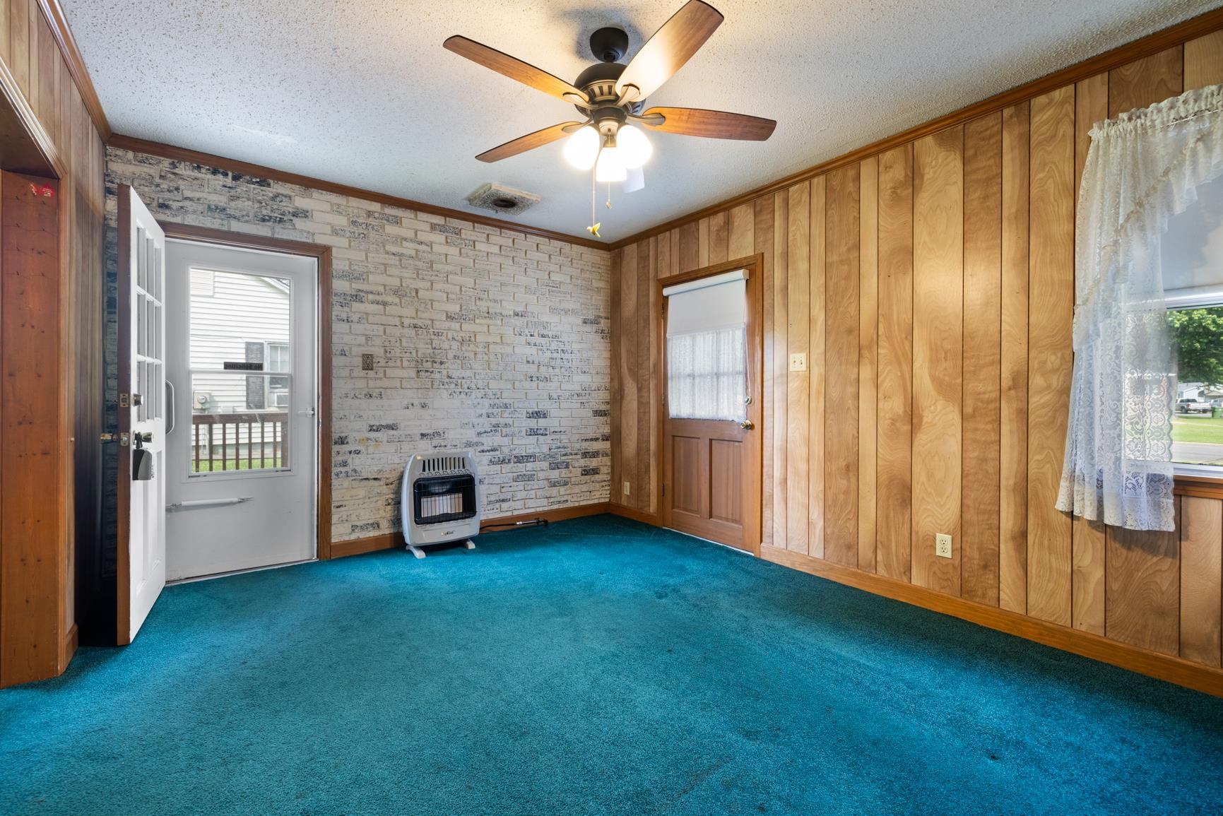7976 Susan Road Millington, TN 38053 - Photo 14 of 25 a view of an empty room with a fireplace and a window