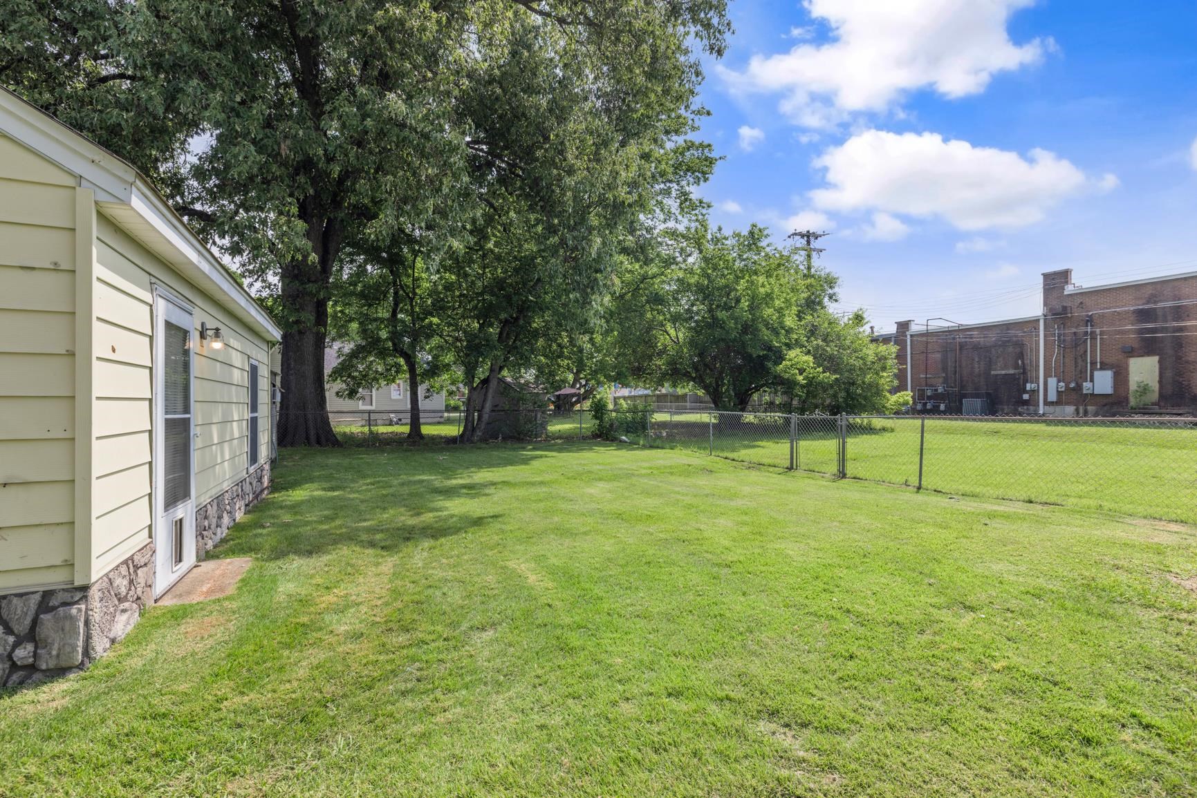 7976 Susan Road Millington, TN 38053 - Photo 4 of 25 a view of yard with a play ground