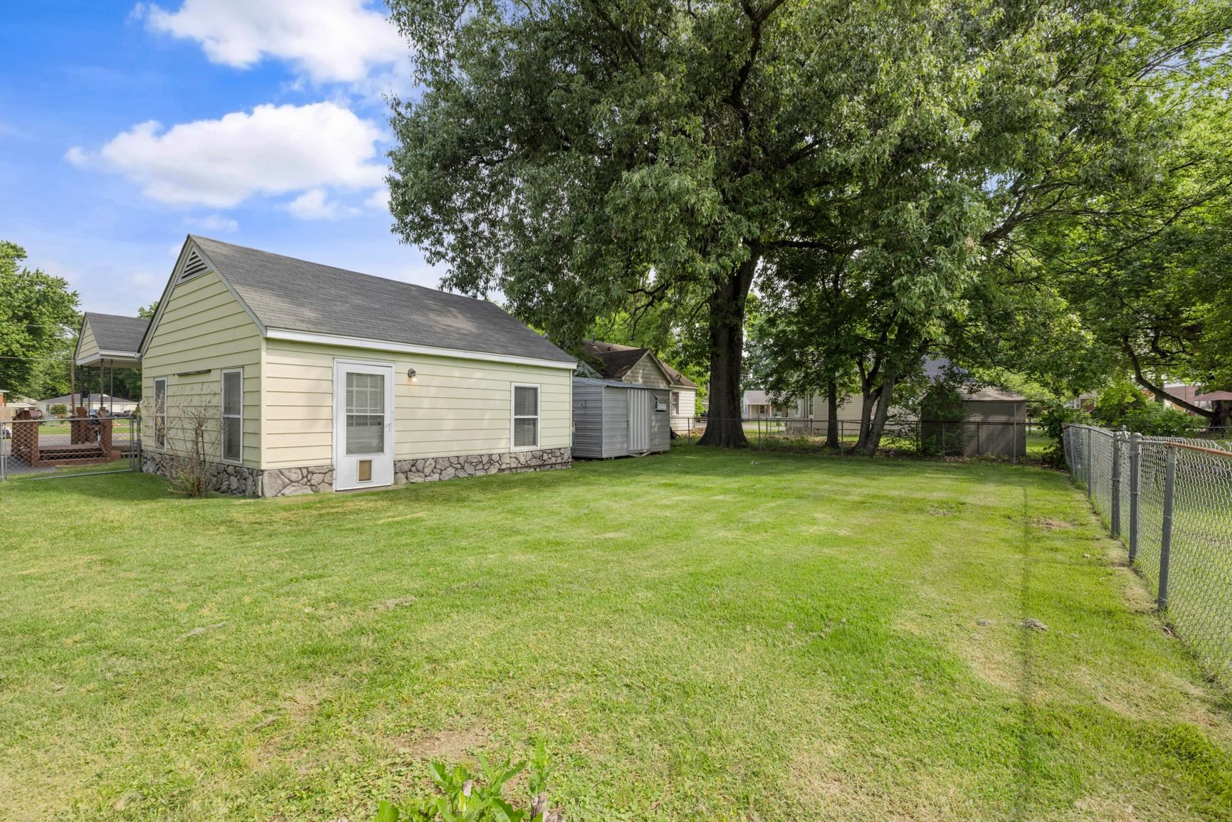 7976 Susan Road Millington, TN 38053 - Photo 6 of 25 a view of a backyard with a garden