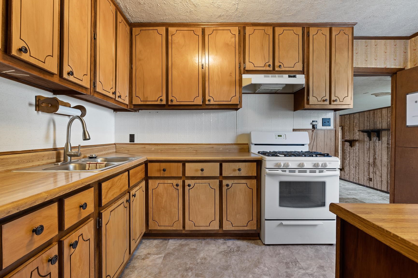 7976 Susan Road Millington, TN 38053 - Photo 7 of 25 a kitchen with stainless steel appliances granite countertop a sink stove and cabinets