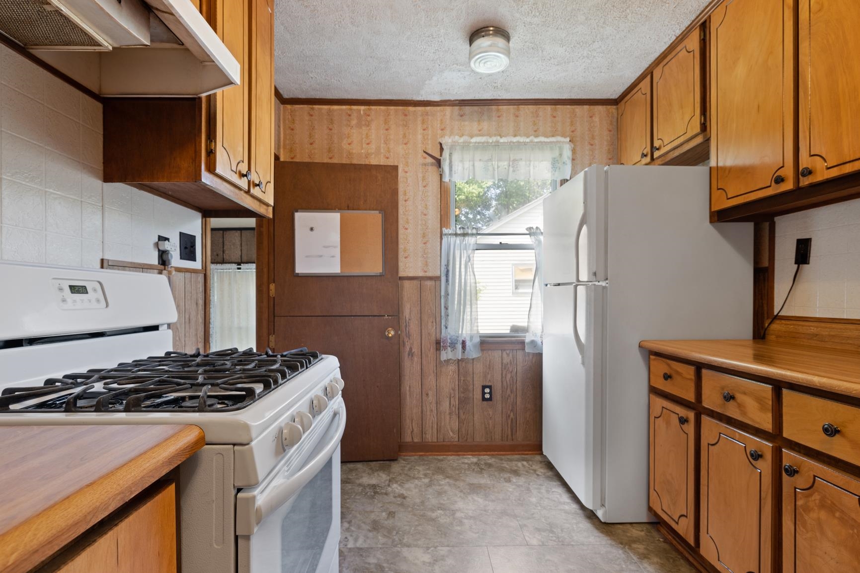 7976 Susan Road Millington, TN 38053 - Photo 8 of 25 a kitchen with stainless steel appliances granite countertop a refrigerator and a stove
