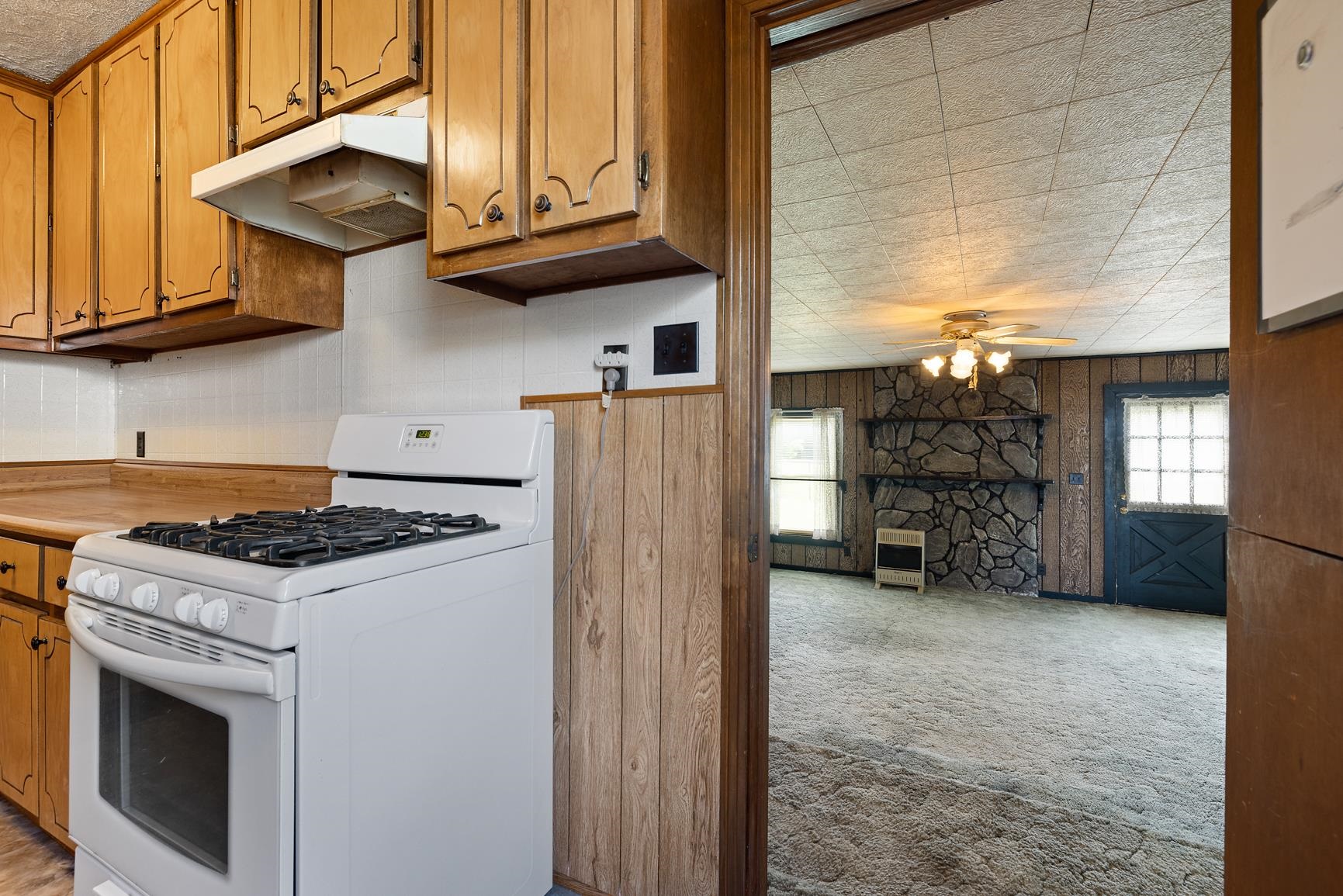 7976 Susan Road Millington, TN 38053 - Photo 10 of 25 a kitchen with stainless steel appliances granite countertop a stove and a refrigerator