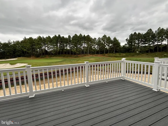 a view of balcony with wooden floor and yard
