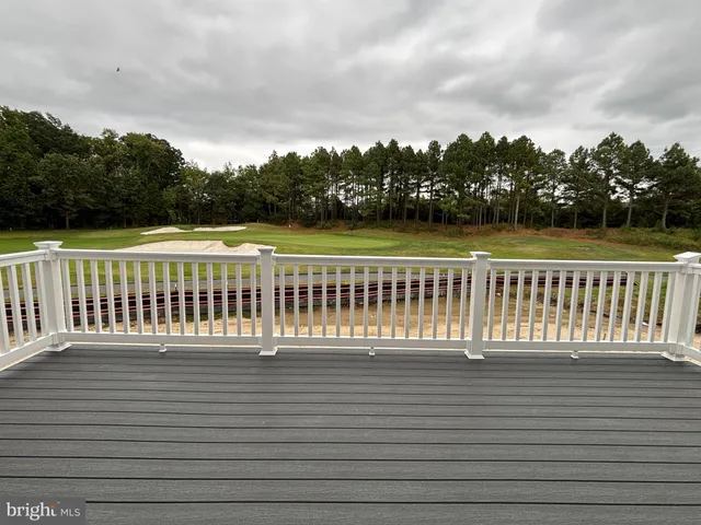a view of a balcony with wooden floor