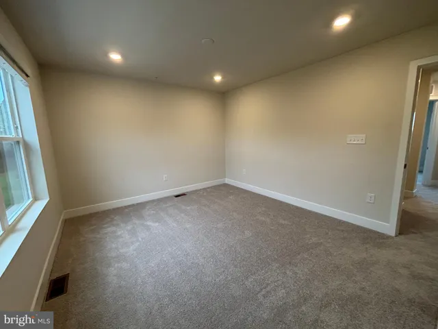 a view of a room that has a large window