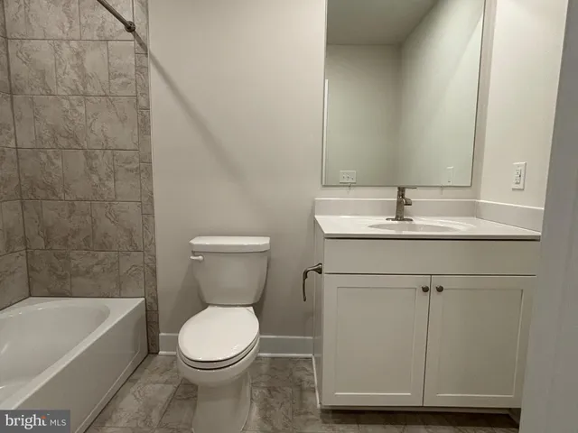 a view of a balcony with wooden floor