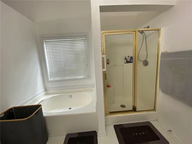 a bathroom with a glass shower door