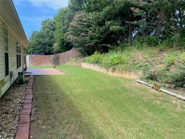 an aerial view of a house with a lake view