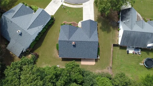 an aerial view of house with yard swimming pool and outdoor seating