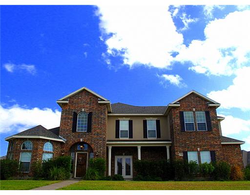 7614 Petit Pointe Corpus Christi, TX 78414 - Photo 1 of 10 a front view of a house with a yard