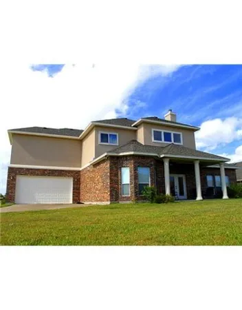 a view of a building with a yard