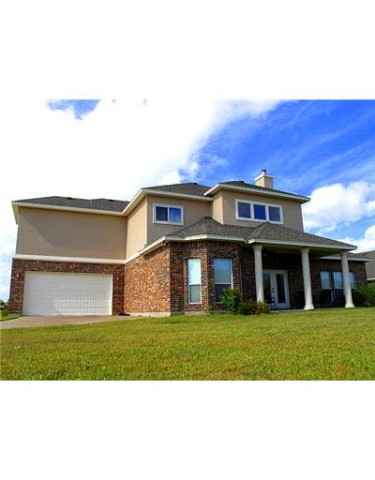 7614 Petit Pointe Corpus Christi, TX 78414 - Photo 2 of 10 a view of a building with a yard