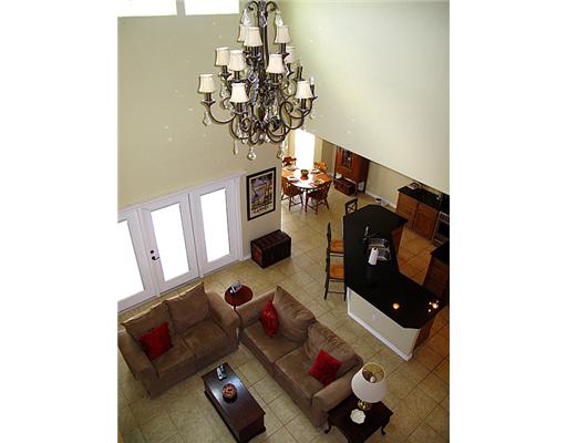 7614 Petit Pointe Corpus Christi, TX 78414 - Photo 4 of 10 a table with chairs and wooden floor