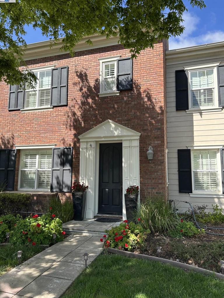 3089 Sweetviolet Drive San Ramon, CA 94582 - Photo 12 of 13 a view of a house with brick walls and a yard with plants