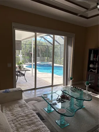 a view of a floor to ceiling window and wooden floor