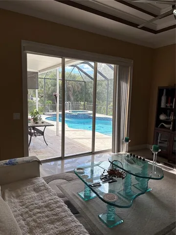 a view of a floor to ceiling window and wooden floor